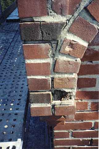 Photograph of water damage to bricks and mortar.